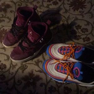 A pair of Jordan 12’s and custom Nike max 97